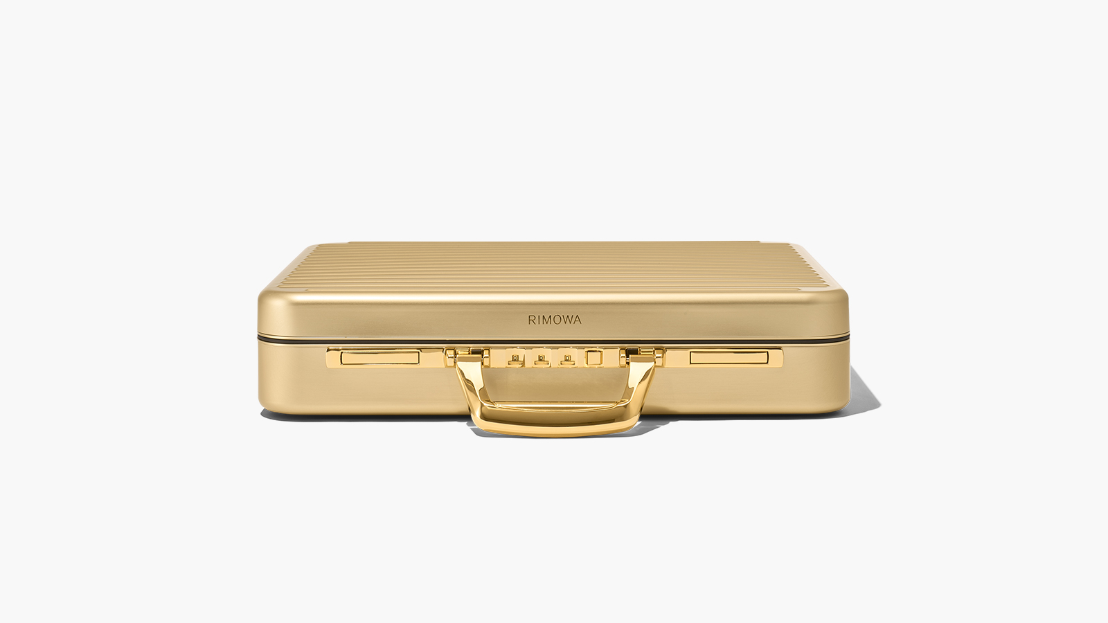 Elevate Your In-Flight Experience With The RIMOWA Attaché Gold - IMBOLDN