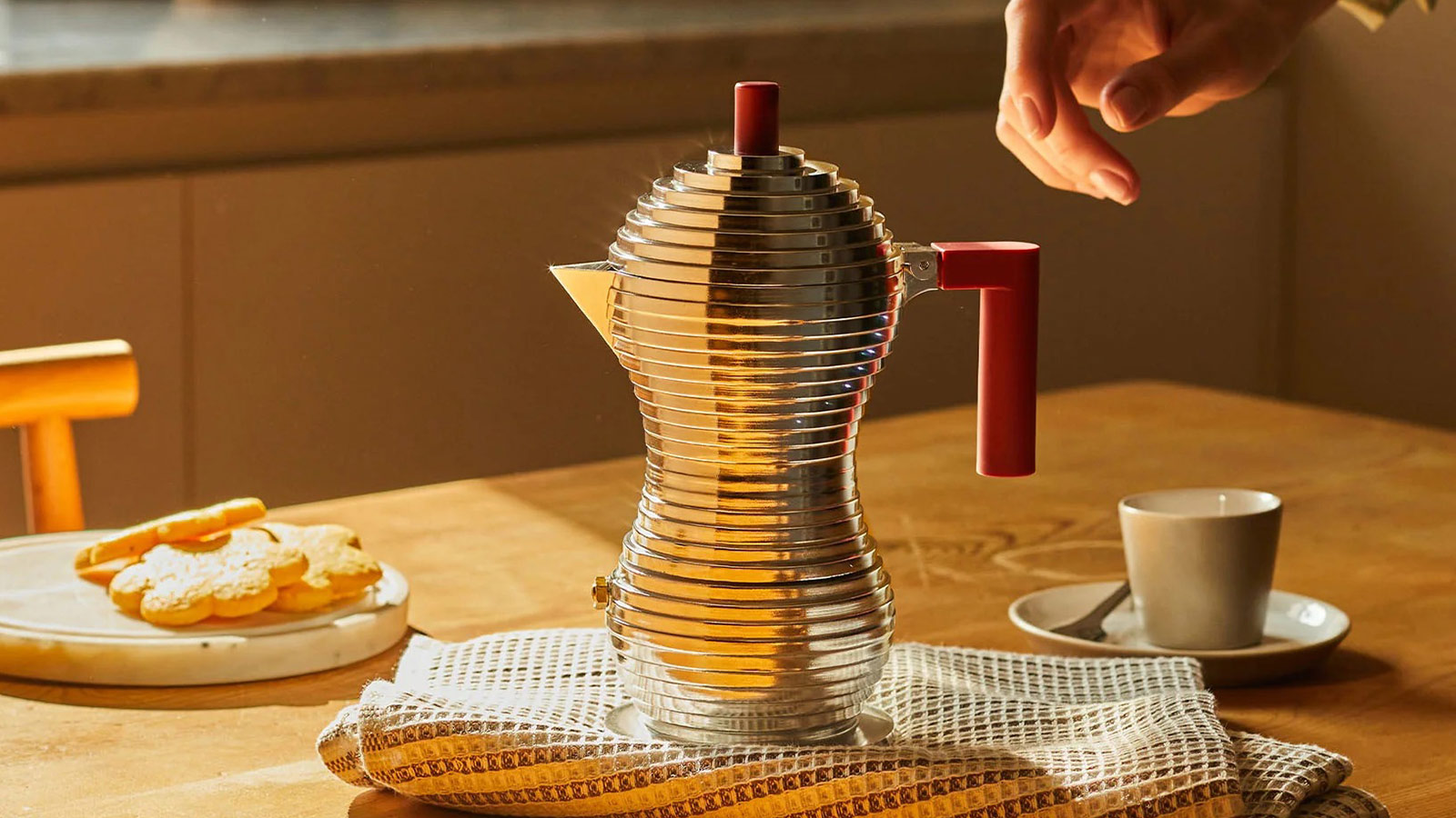 Modern aluminum Pulcina espresso maker brewing on a warm kitchen table for Best Coffee Gifts for 2025.