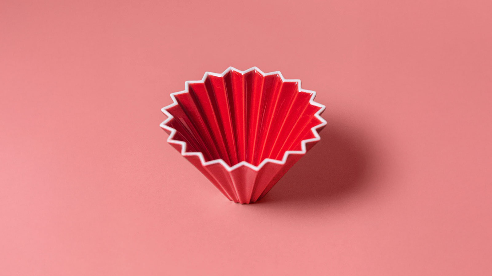 Red Origami coffee dripper with fluted ceramic design for Best Coffee Gifts for 2025.