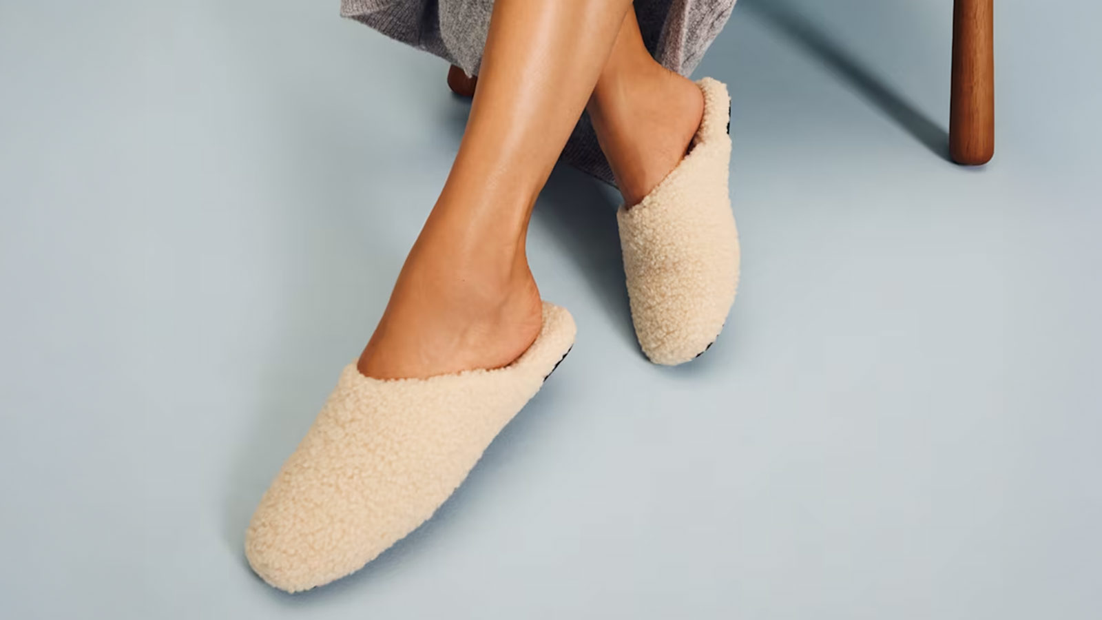 Cozy sherpa-lined cream slippers, ideal for lounging and included in the best holiday gifts for women roundup