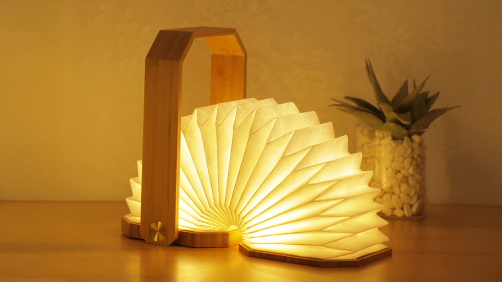 Foldable origami‑inspired LED lamp that doubles as functional art — a creative gift for design lovers.