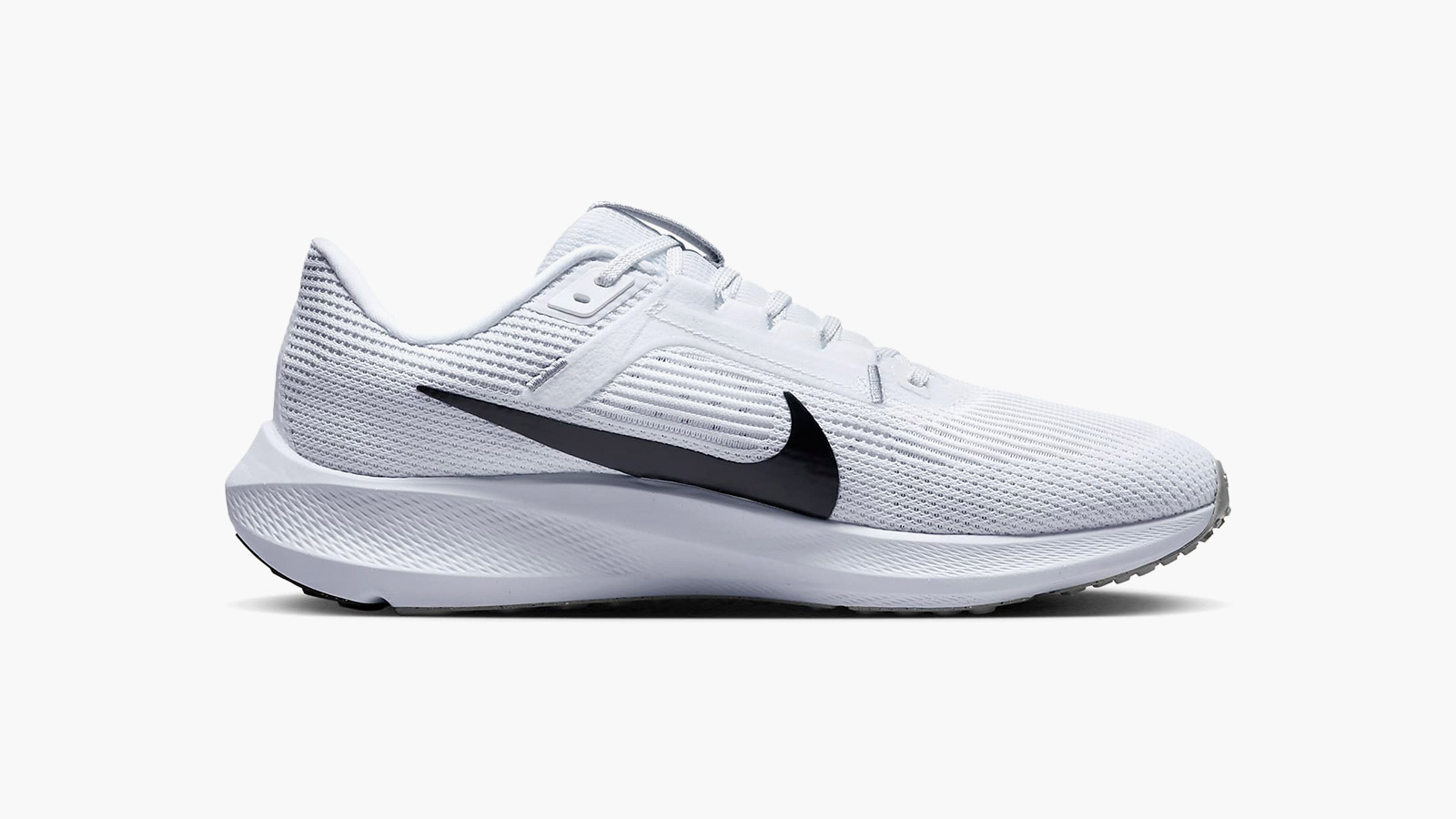 white nike running shoe with a black swoosh