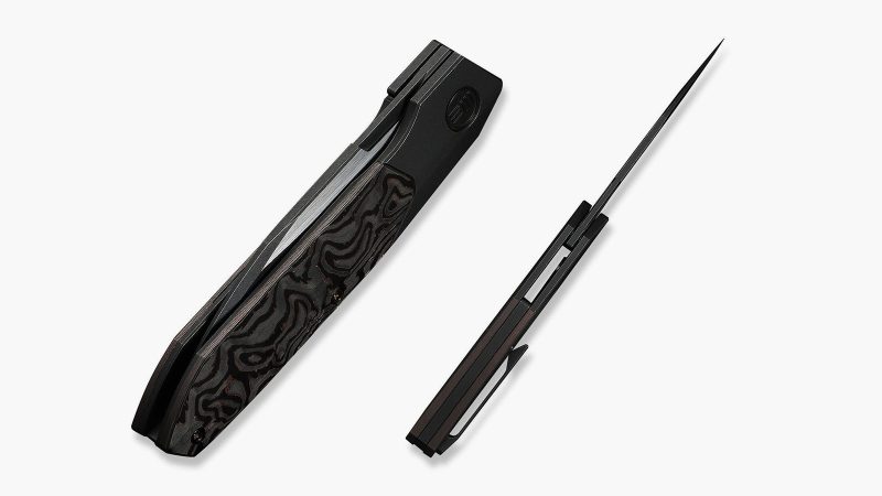 The WEKNIFE Brr15 has a rugged black titanium frame inlaid with copper foil.