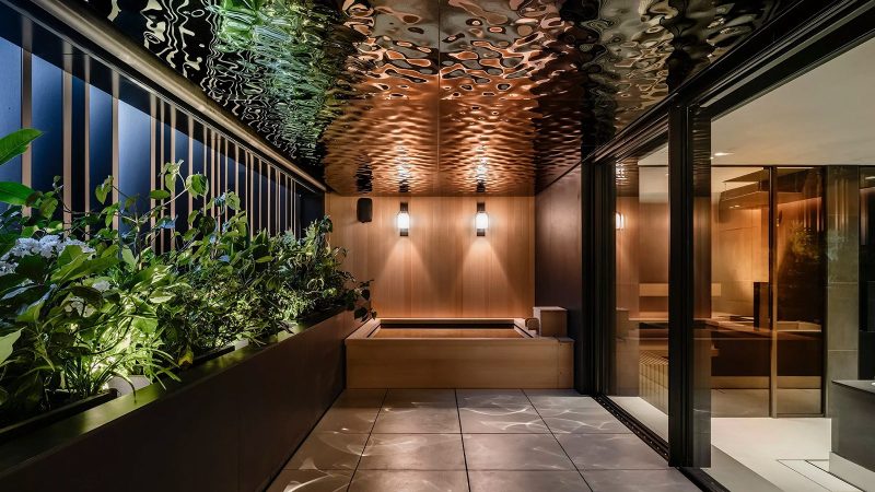 Aston Martin’s N°001 Minami Aoyama is a four-story Tokyo townhouse with vertical metal louvers and sculptural design by Aston Martin and VIBROA.