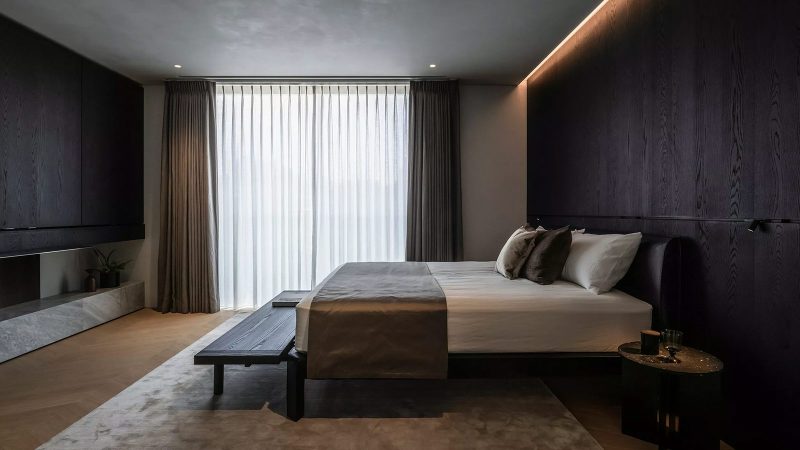 Aston Martin’s N°001 Minami Aoyama is a four-story Tokyo townhouse with vertical metal louvers and sculptural design by Aston Martin and VIBROA.