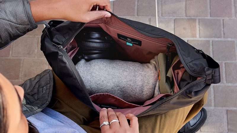 Bellroy’s Laneway Crescent Bag is a recycled nylon cross-body sling design featuring a wide-mouth zipper, internal tool belt pocket, quilted back panel, adjustable webbing strap, and AirTag sleeve.