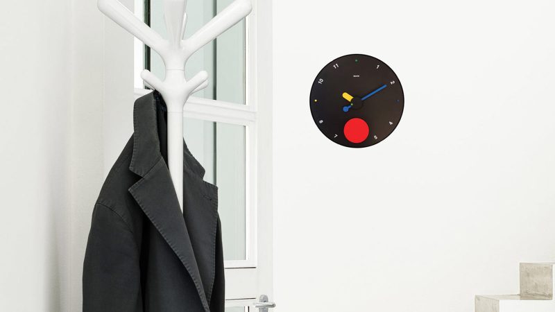 MoMA Exclusive Contrattempo Wall Clock with bold red swinging disc, inspired by Memphis Design, crafted from recycled ABS and aluminum.