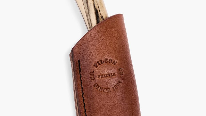 The Filson x Graycloud Scout Knife boasts a handcrafted, heirloom-quality blade.