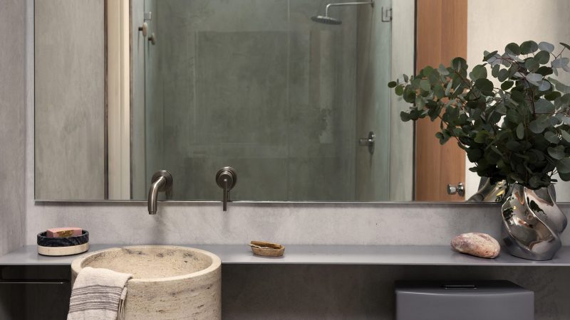 Sculptural concrete dome house in California’s High Desert, designed by Anastasiya Dudik, with curved monolithic exterior, saltwater pool, and minimalist brutalist interior built from concrete, stone, and plaster.