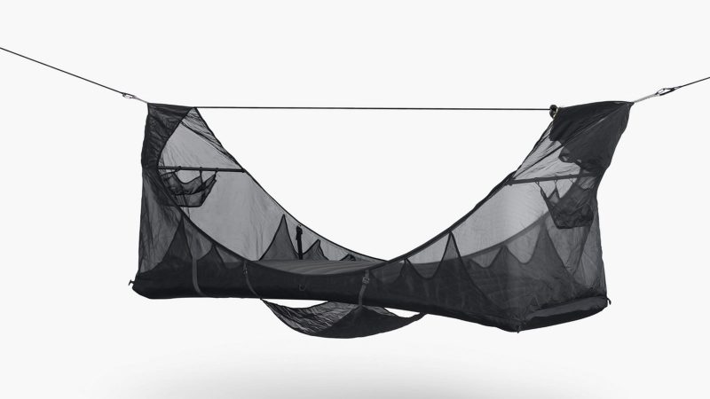 Haven Spectre ultralight lay-flat hammock tent suspended between trees, featuring carbon spreader bars, inflatable mattress, Monolite mesh, and compact setup