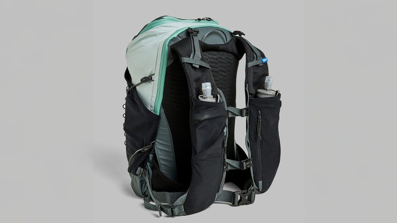 Janji Revy Pack ultra-light running vest with breathable mesh, hydration compatibility, and trail-ready storage for endurance and mountain runners.