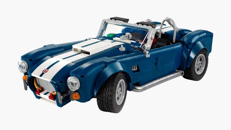 LEGO's Icons Shelby Cobra 427 S/C model car kit for adults features a blue body, white racing stripes, and a detailed V8 engine.