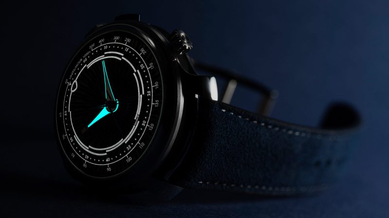 The MING 20.01 Series 5 features a laser-milled blue titanium radial dial, central chronograph hands, a polished steel and DLC titanium case, and a dark blue strap.