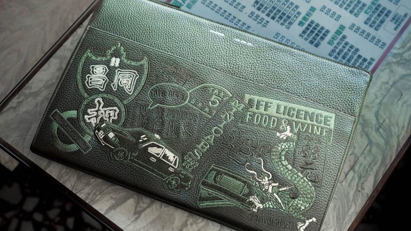 MR LEE x GRAMS28 stealth black leather backpack with tone-on-tone Hong Kong–London embroidered design.