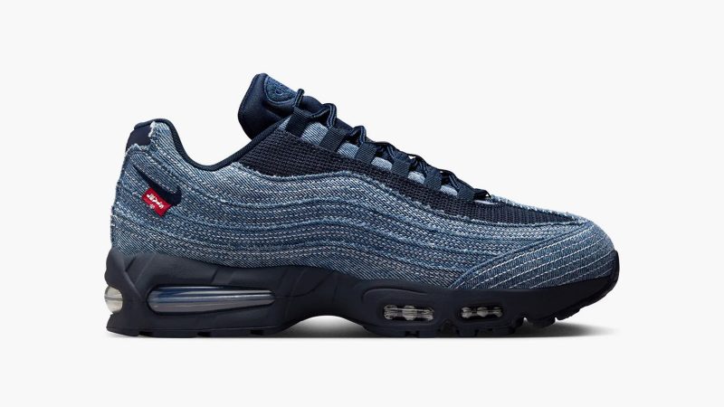 Levi’s x Nike Air Max 95 sneakers in denim with frayed edges, co-branded red accents, and matching relaxed jeans and denim jacket from the collection.