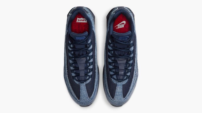 Levi’s x Nike Air Max 95 sneakers in denim with frayed edges, co-branded red accents, and matching relaxed jeans and denim jacket from the collection.