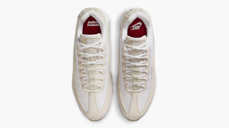 Levi’s x Nike Air Max 95 sneakers in denim with frayed edges, co-branded red accents, and matching relaxed jeans and denim jacket from the collection.