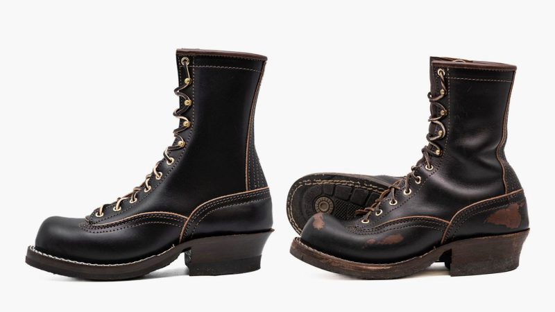 Nick's x Carl Murawski Blackwood 8 " logger boots in overdyed black English bridle leather, showing an emerging brown patina, brass hardware, and Supergrip soles.