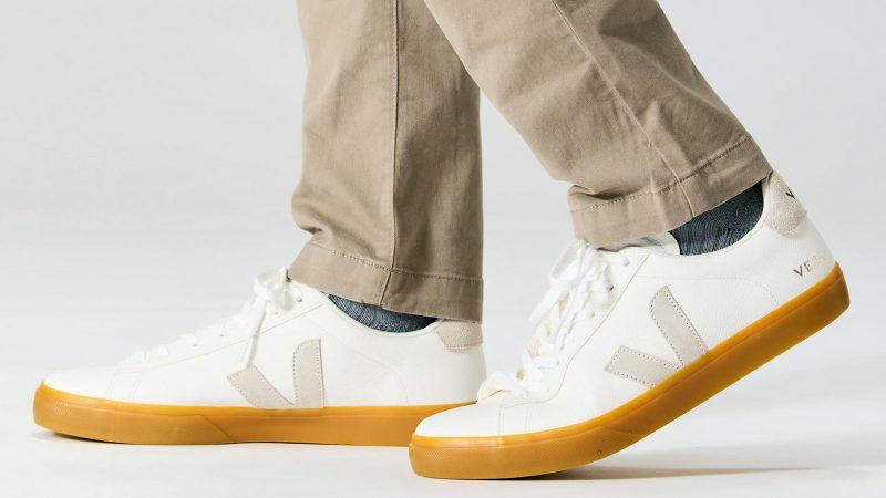 White VEJA sneakers with gum soles—clean, sustainable kicks for the best men’s summer wardrobe essentials 2025.