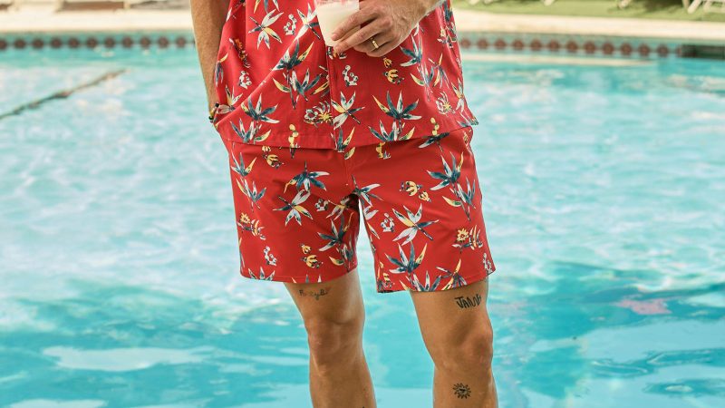 Red floral poolside shorts for vibrant summer days—a key player in the best men’s summer wardrobe essentials 2025.