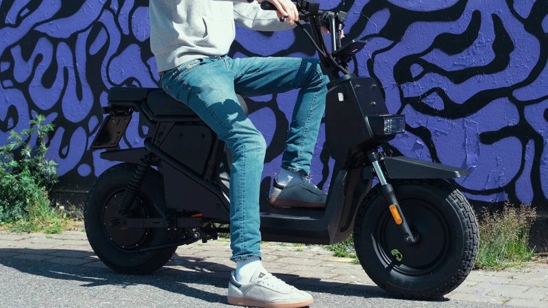 Teenage Engineering x Vässla EPA‑1 electric moped in matte black with modular front rack and screw‑mount accessory points.