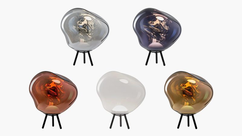 Tom Dixon's Melt Portable Lamp features a reflective mirror-finish shade, and a tripod base.