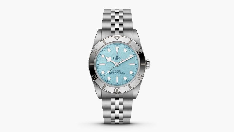 Tudor's Black Bay 54 Lagoon Blue dive watch boasts a 37mm stainless steel case, sand-textured blue dial, and a five-link bracelet.