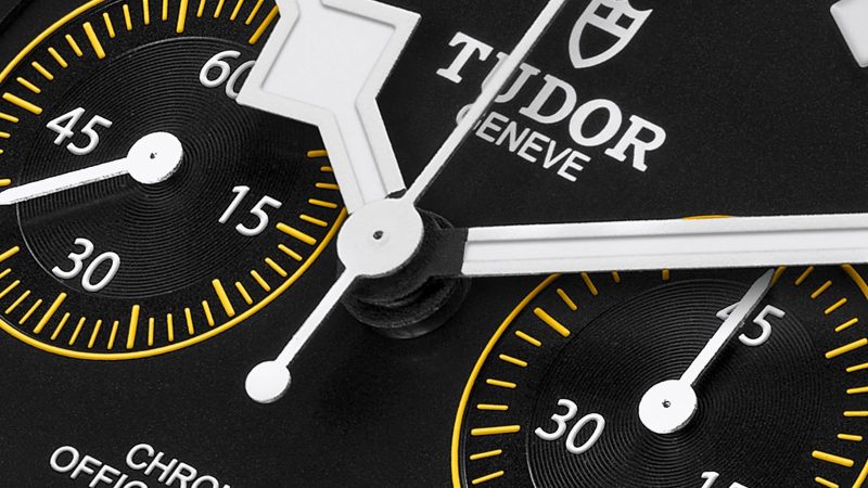 Tudor Pelagos FXD Chrono “Yellow” cycling watch with 43mm carbon case, yellow-striped strap, and COSC-certified chronograph movement honoring Fabian Cancellara.