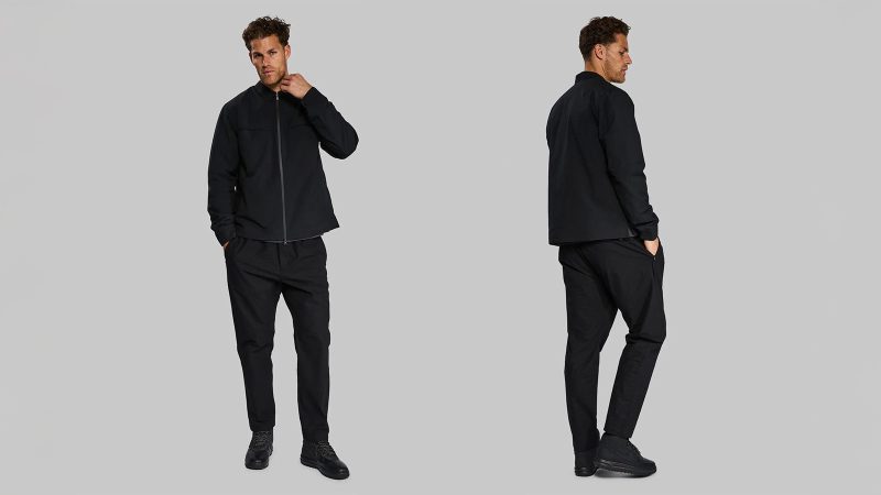 Vollebak Ultra High Molecular Weight Pants in black with ripstop UHMWPE grid, water-repellent finish, and concealed zip pockets.