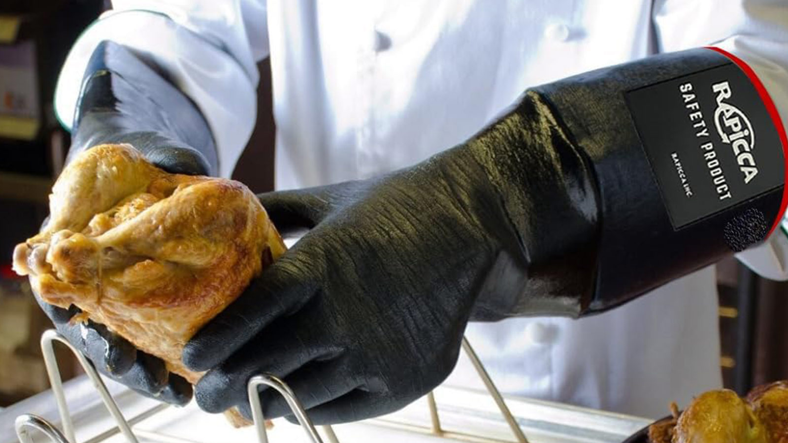 RAPICCA BBQ gloves holding hot roast chicken—heat-resistant gear that ranks among the best grilling tools for safety.