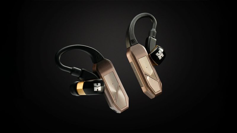 iFi GO Pod Max wireless earbuds with ergonomic stems and charging case, emphasize long battery life, ANC, and hi‑res audio capabilities.