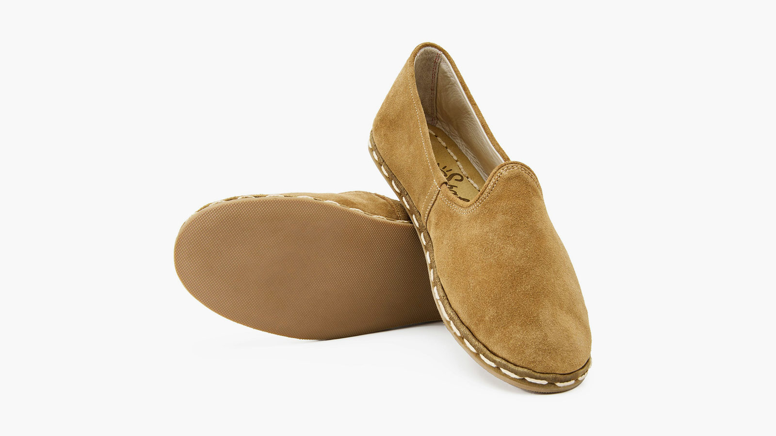 Suede slip-on with rubber sole, representing timeless craftsmanship in men’s best slip-on shoes.