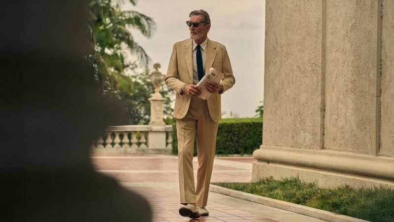 Well-dressed man walking outside, showing confidence and style in a morning routine for men.