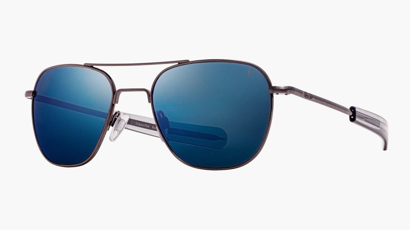 Limited-edition American Optical Original Pilot “Blue Moon” sunglasses featuring silver-aged antique frames and deep blue SunFlash mirror lenses.
