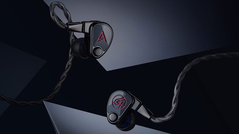 Astell&Kern × 64 Audio XIO ten‑driver in-ear monitors in black DLC stainless steel with premium braided cable, shown angled to highlight metal finish.