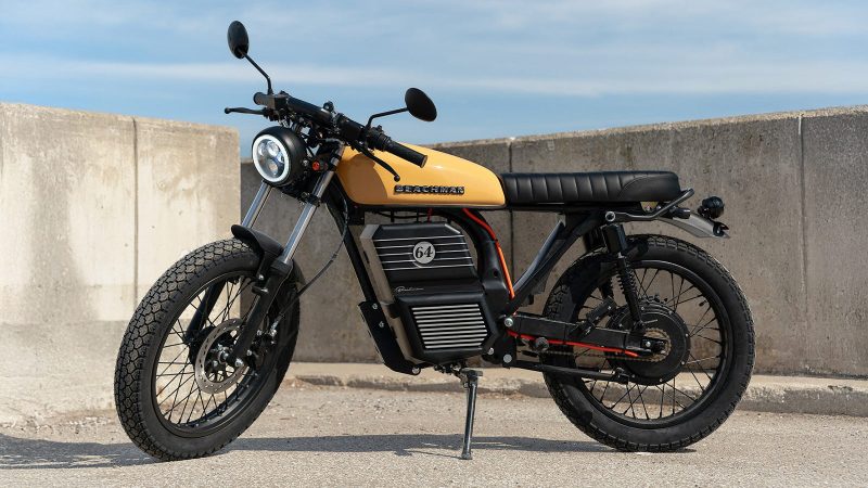 The Beachman ’64 e-bike captures the spirit of a classic Café Racer with a sleek electric drivetrain, offering up to 70 miles of range and vintage-inspired style.