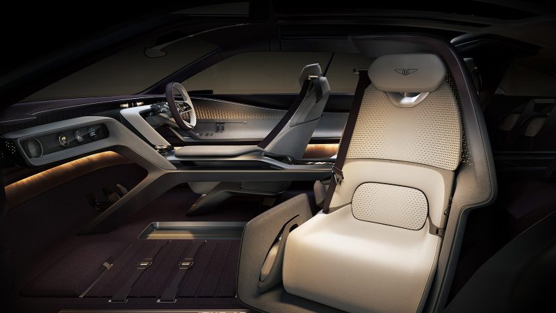 The Bentley EXP 15 all-electric concept GT has a three-seat layout, asymmetrical doors, a luxury retro-modern interior, a robot-inspired front grille, and a Champagne-ready trunk.