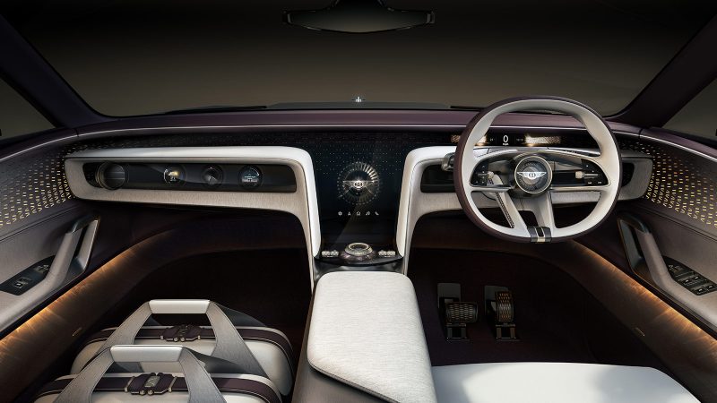 The Bentley EXP 15 all-electric concept GT has a three-seat layout, asymmetrical doors, a luxury retro-modern interior, a robot-inspired front grille, and a Champagne-ready trunk.