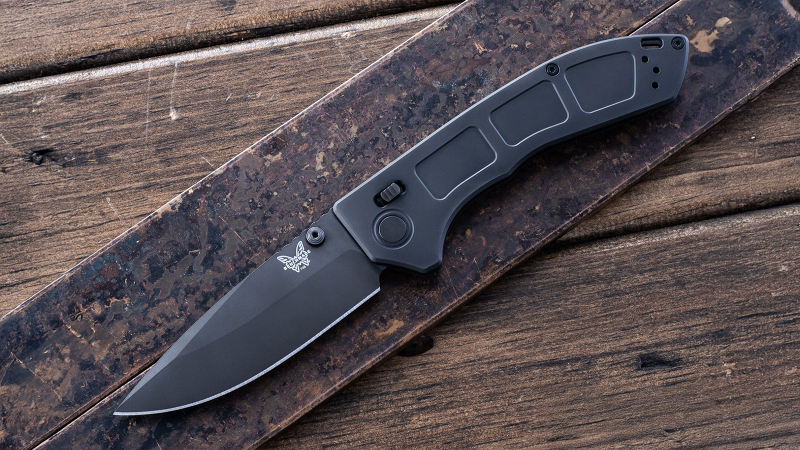 Benchmade Narrows black folding knife on wood background, high-performance pick in the Best EDC Knives for Men 2025.