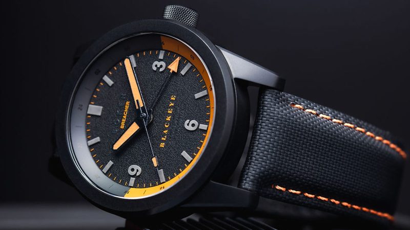 Bōken x Blackeye Phantom Breacher GMT watch featuring a black DLC-coated case, Swiss Sellita movement, orange lume, and a limited run of 42 pieces for a rugby charity.