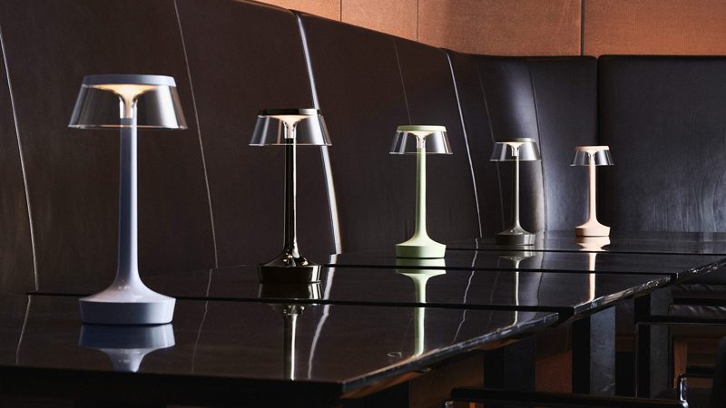 Bon Jour Unplugged wireless table lamp by Philippe Starck features LED lighting, sleek modern design, and customizable crown finishes.