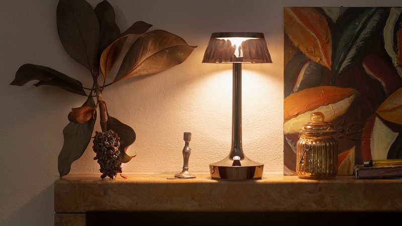 Bon Jour Unplugged wireless table lamp by Philippe Starck features LED lighting, sleek modern design, and customizable crown finishes.