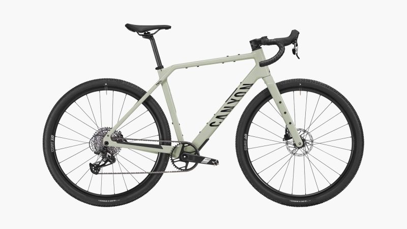 Canyon Grizl CF 6 carbon gravel bike with integrated fork mounts, tubeless tires, and endurance geometry designed for off-road adventure riding.