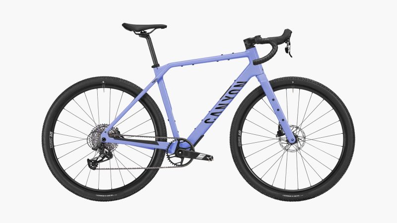 Canyon Grizl CF 6 carbon gravel bike with integrated fork mounts, tubeless tires, and endurance geometry designed for off-road adventure riding.
