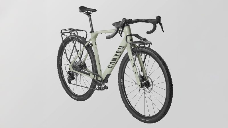 Canyon Grizl CF 6 carbon gravel bike with integrated fork mounts, tubeless tires, and endurance geometry designed for off-road adventure riding.