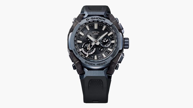Casio MT‑G B4000 blue‑gray watch showcasing a layered carbon‑fiber case, stainless steel bezel, rugged Dual Core Guard structure, and tech controls.
