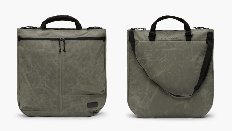D_B_ Utility Tote 32L with recycled materials, front zip pockets, laptop sleeve, and adjustable strap for commuting, travel, and cycling use.