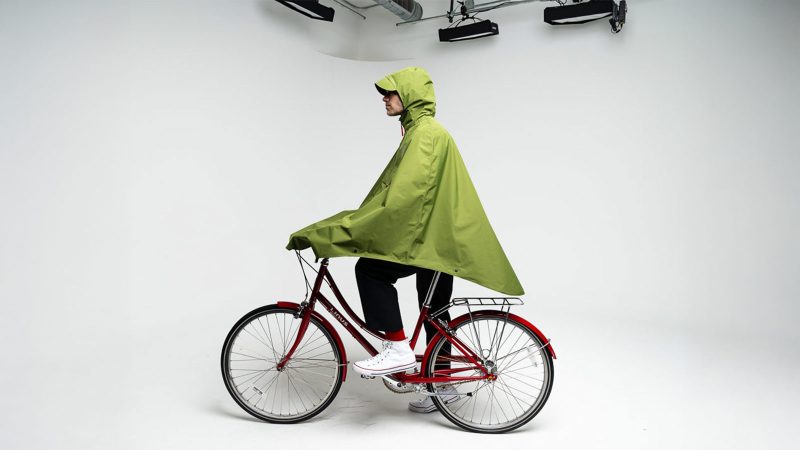Cleverhood Rover Rain Cape in green – weather-ready cycling cape with reflective details, a standout pick in the best commuter gear for men.