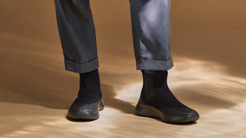 Allbirds Runner Chelsea Protect boots in motion – water-resistant knit footwear that blends casual comfort and smart commuter style.