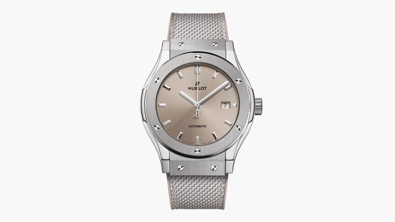 Hublot Classic Fusion Essential Taupe in titanium with sunburst taupe dial, polished bezel, and textured strap in 42mm and 45mm sizes.